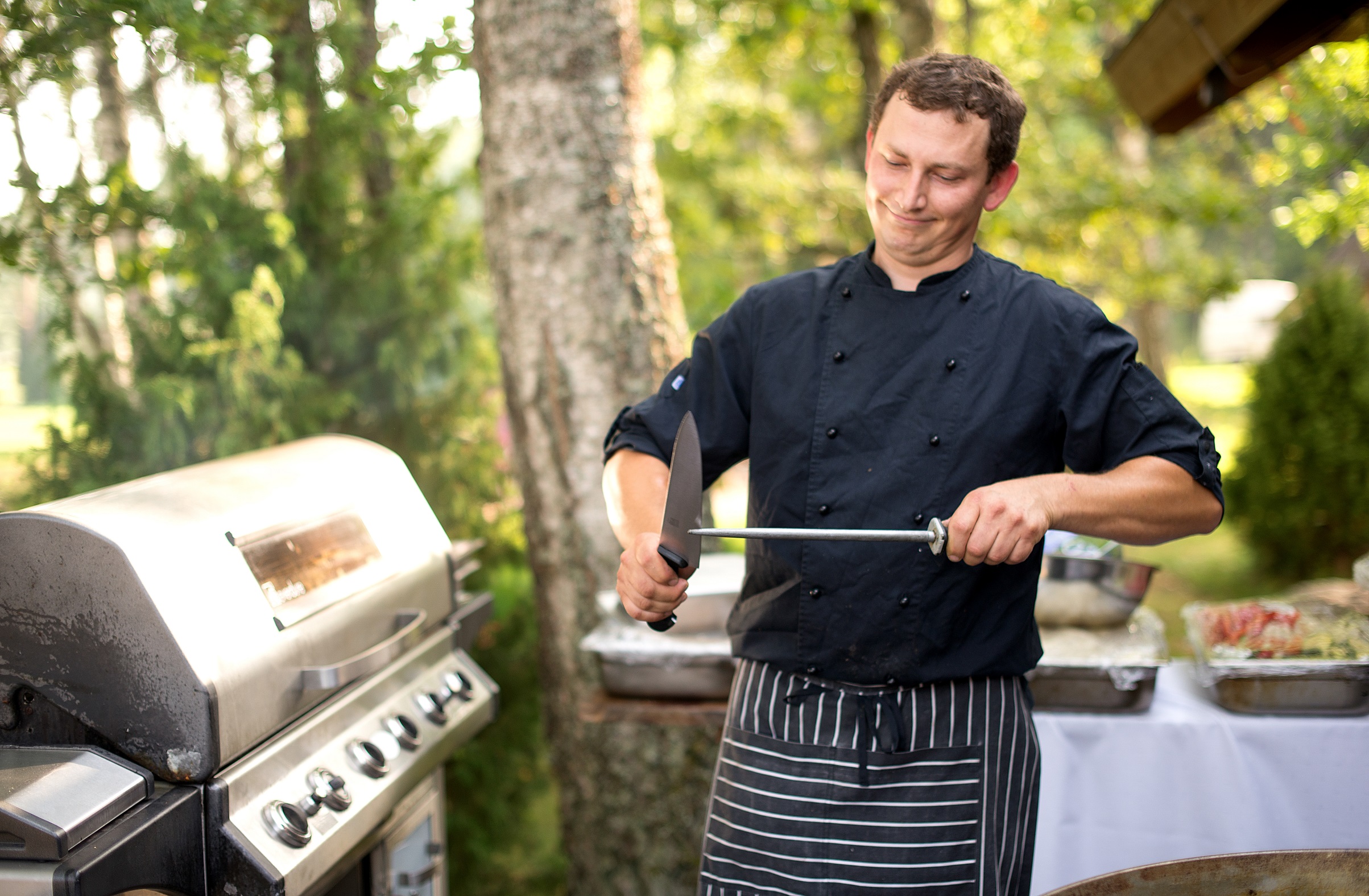 cook professional working in outdoor kitchen 2022 11 09 06 51 43 utc