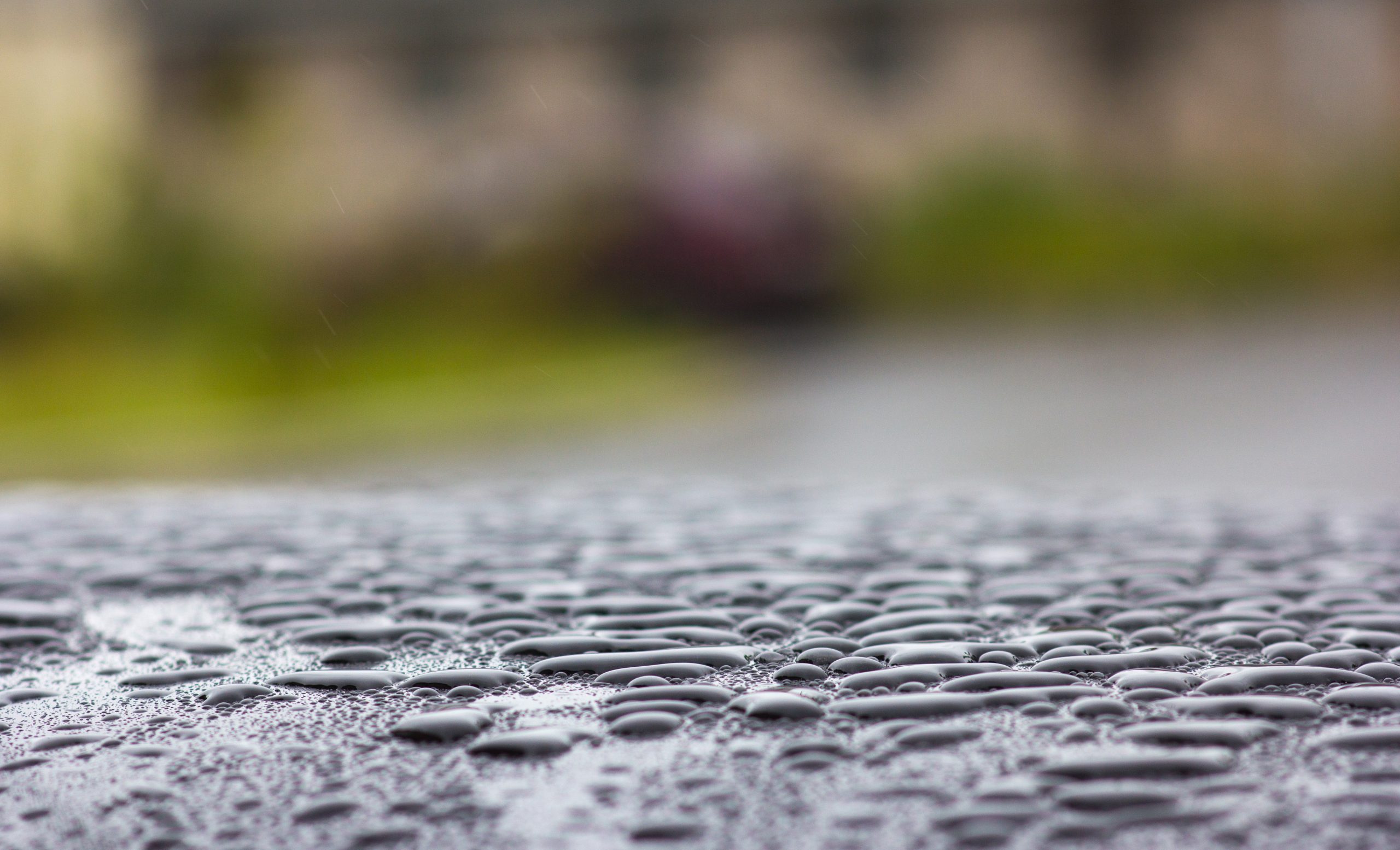large drops of rain on the roof of the car close 2024 10 18 05 18 56 utc scaled