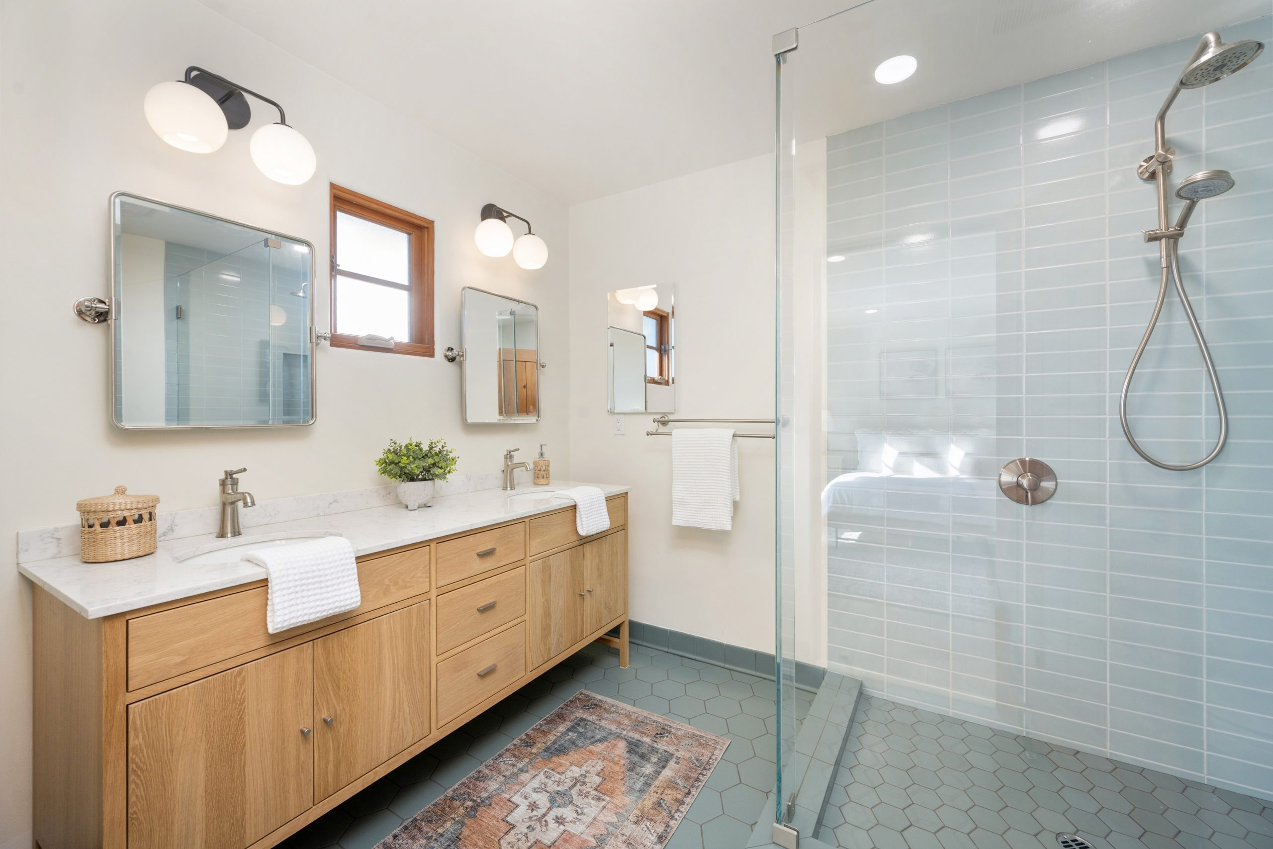 a white bathroom with tiled walls and wood cabinet 2025 02 11 19 46 06 utc scaled